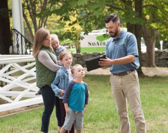 SavATree worker showing family ipad